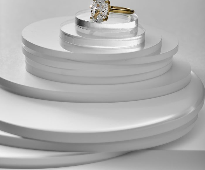 Gold and diamond ring on display