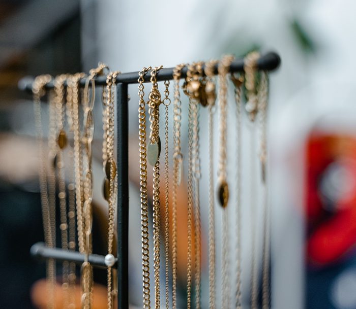 Gold necklaces on jewelry stand